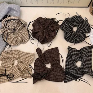 Set of 6 plaid scrunchies with black ribbon accents in beige and coffee colors