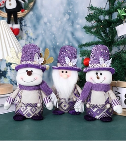 Detail of purple sequin Santa gnome and snowmen plush figurines for Christmas decor