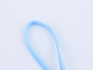 Detailed close-up of light blue braided fabric strap on a white background