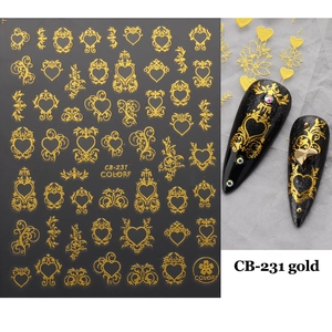 Macro shot of 3D gold heart rose nail stickers with Baroque metallic patterns CB-231