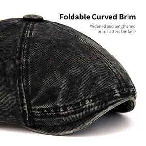 Vintage washed black denim newsboy cap with curved brim and heavy twill texture