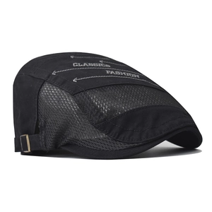 Detail of black canvas flat cap with breathable mesh and white classics printing
