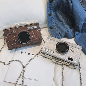 Sparkly camera-shaped crossbody bags in brown and silver glitter with chain straps