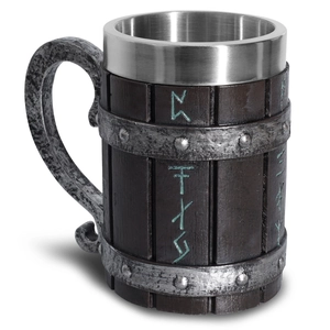 Macro detail of Viking beer mug featuring aged wood texture and silver rune carvings