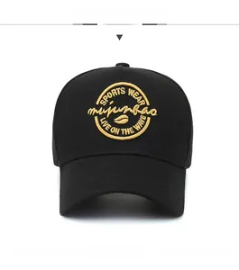 Close-up of golden embroidery on black cotton baseball cap showing detailed sports text