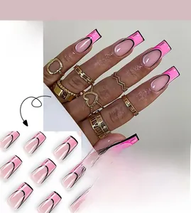 Detail of French-style press-on nails with 2D cartoon outlines and pink base