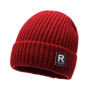 Thick red knitted winter beanie for men with warm fleece lining and fashion logo patch