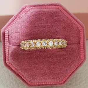Detailed view of eternity ring with cubic zirconia in pink velvet jewelry gift box