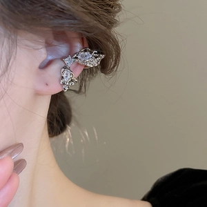 Close-up of a silver multi-layer butterfly ear cuff with sparkling zircon inlay