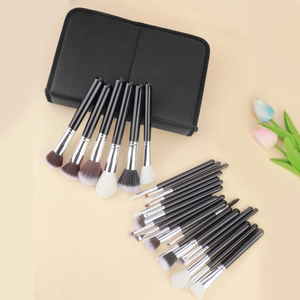 Detail of 25 professional makeup brushes with soft bristles and black zipper storage case