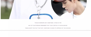 Detail of silver splice chain necklace with minimalist cross pendant on model