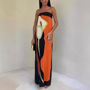 Women strapless long dress featuring abstract avocado floral print in orange and black