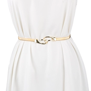 Detail of interlocking gold metal elastic spring belt fastened on a white dress