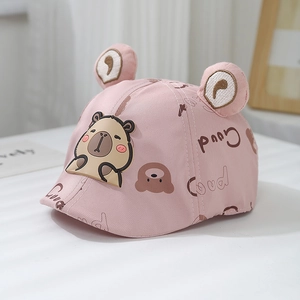 Close-up of baby pink cotton cap with 3D ears, cartoon bear patch and Good print detail