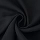 Macro detail of black V-neck lace dress fabric showing soft spiral texture and material