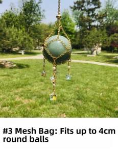 Detail of size 3 gold mesh cage pendant with pearls holding a 4cm green crystal ball