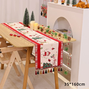 Detail of 35x160cm Christmas table runner with snowman patterns and colorful tassels