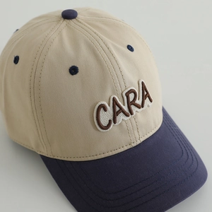 Retro two-tone kids baseball cap with CARA embroidery in beige and navy blue
