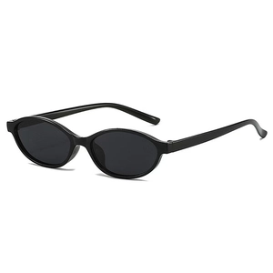 Detailed view of vintage oval sunglasses with sleek black frames and dark tinted lenses