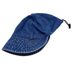 Detail of washed denim bucket hat with wide brim and adjustable black toggle drawstring