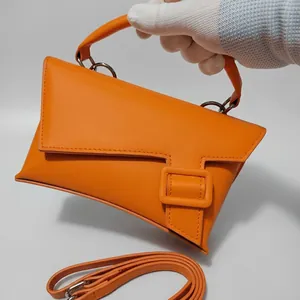 Vibrant orange geometric crossbody waist bag with top handle and adjustable strap