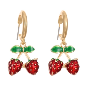 Close-up of red strawberry earrings with gold hoops and green leaves on white background