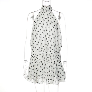 Detail of black and white polka dot halter neck dress with layered ruffle hemline