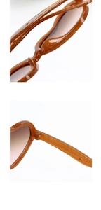 Close-up of glitter-embedded amber heart frames and metal hinges on children's sunglasses