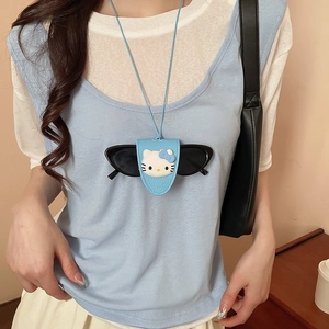 Detail of light blue leather glasses holder with cartoon cat design on long necklace