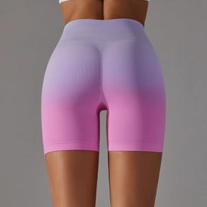 Macro shot of seamless high waist shorts with gradient purple to pink compression fabric