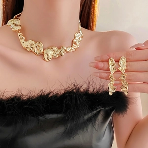 Golden irregular pleated metal necklace and earrings set with organic molten texture