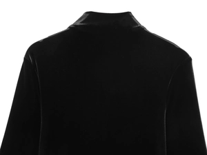 Detail view of the black velvet fabric texture and high collar back on this stylish dress