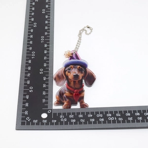 Acrylic dachshund keychain ornament with scale ruler showing 60mm height measurement
