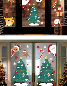 Detailed Christmas window decals featuring Santa, reindeer, and snowflakes on glass doors
