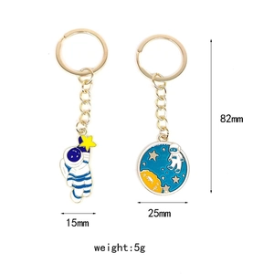 Detailed size specifications of gold alloy astronaut keychain with blue enamel planet charms