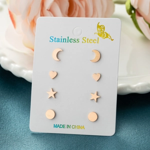 Detailed view of rose gold stainless steel earring set with heart and star shapes