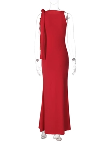 Detail view of red one-shoulder dress with elegant draping scarf on shoulder