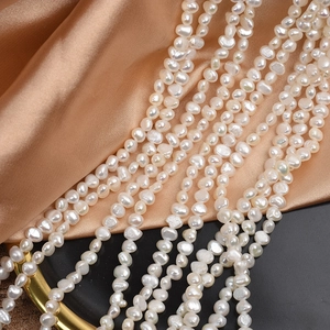 Baroque natural freshwater pearls strands in milky white and champagne on silk