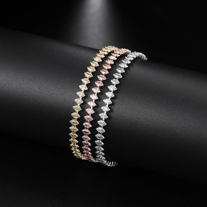 Close-up of marquise-cut crystal tennis bracelets in gold, rose gold and silver finishes