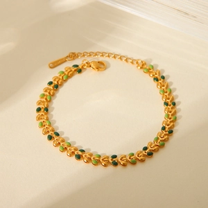 18K gold plated stainless steel leaf bracelet with green enamel in a circular layout