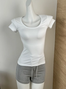 Detailed view of the fine ribbed knit texture on a white slim fit U-neck short sleeve tee