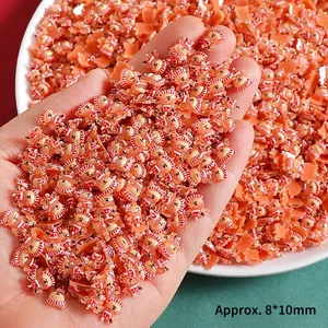 Detailed close-up of a mini 8x10mm resin bear charm for DIY nail art and phone case craft