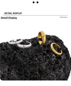 Close-up of S925 sterling silver open ring with matte brushed texture on volcanic rock