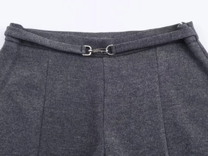 Close-up of dark grey twill trousers waist with matching belt and silver metal buckle