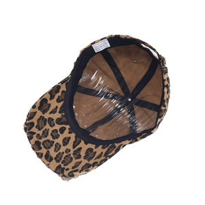 Close-up of 100% cotton inner structure and leopard print stitching on baseball cap