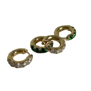 Elegant gold plated brass hoop earrings set with green and white cubic zirconia stones