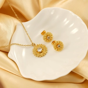 Golden sunflower necklace and earrings jewelry set with zircons on shell display