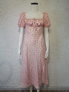 Detail of square neckline with drawstring ruching on pink floral puff sleeve dress