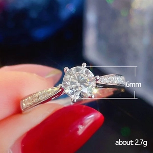 Classic silver six-prong engagement ring with 6mm main stone and pavé diamond band