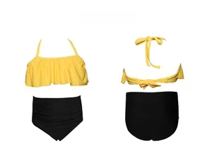 Detail of yellow ruffled halter top and high-waisted black bikini bottoms for girls